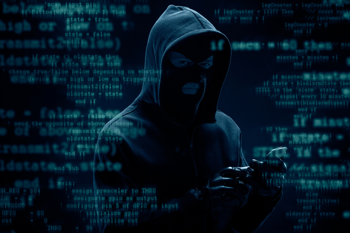 Cliche hacker stock photo with balaclava and hoodie